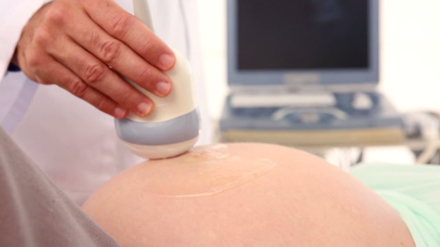 Pregnant woman having a sonagram scan