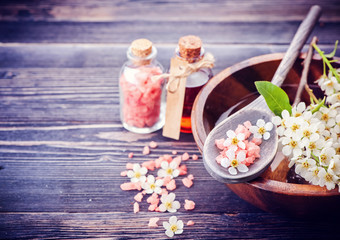 Obraz na płótnie Canvas Spa. Aromatherapy essential oils, flowers, sea salt. Spa set