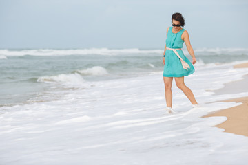 Young beautiful woman enjoying beach vacation