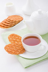 Cup of tea with sweet waffles