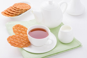 Cup of tea with sweet waffles