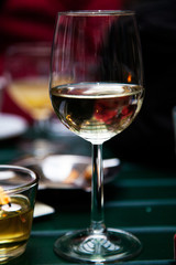 Glass of wine in cafe, with candle