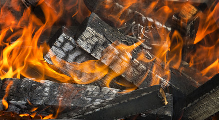 Firewood on fire background