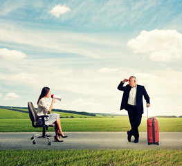 woman and senior man with suitcase