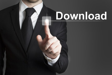 businessman pressing virtual button download