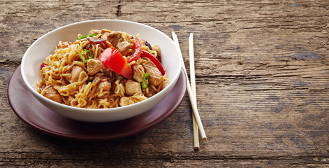 bowl of noodles with chicken and vegetables © Mara Zemgaliete