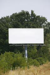 Empty billboard on background of sunset sky