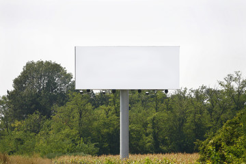 Empty billboard on background of sunset sky