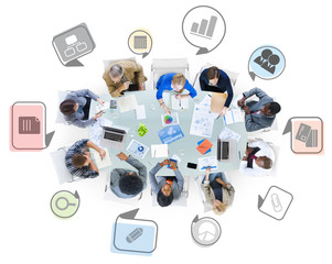 Group of Business People in a Meeting with Business Symbols
