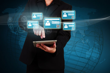 Businessman holding a tablet with virtual  card and community ic