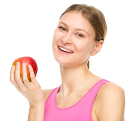 Young happy girl with apple