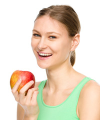 Young happy girl with apple