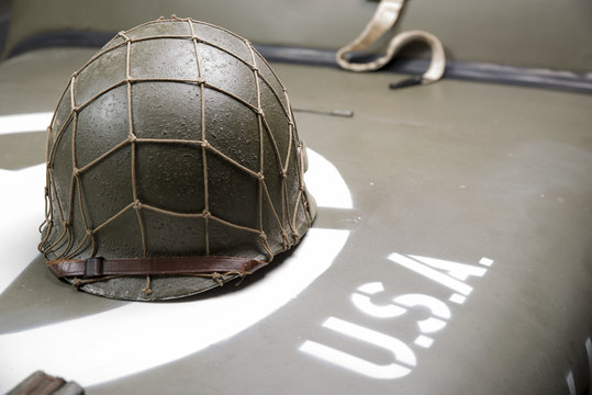 military helmet on the hood of military vehicle