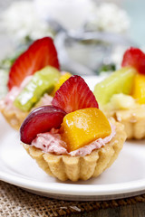 Beautiful cupcakes decorated with fresh fruits