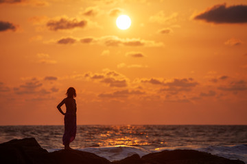 Woman takes rest at the sea shore