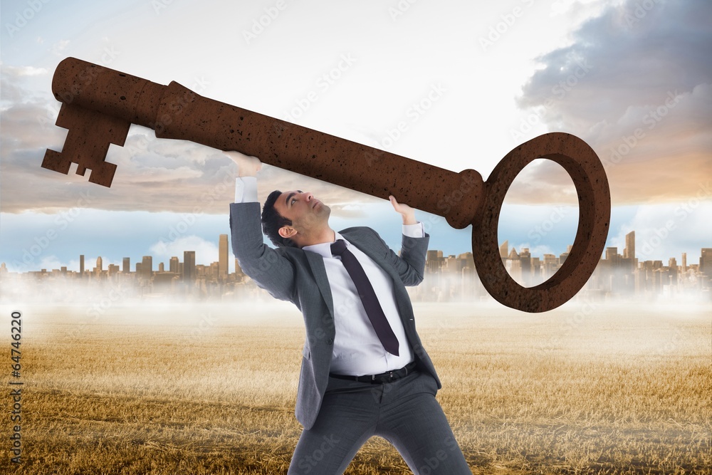 Poster composite image of unsmiling businessman carrying large key