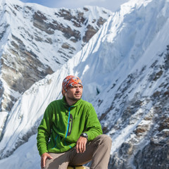 Hiker rests on trek in Himalayas, Nepal