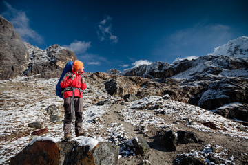 Naklejka premium Hiker posing in Himalayas in front of big mountains