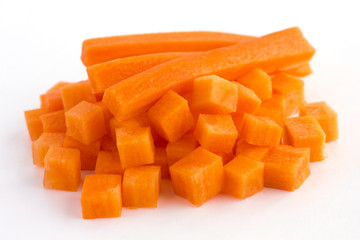 Carrot neatly chopped into cubes ready to be used - obrazy, fototapety, plakaty