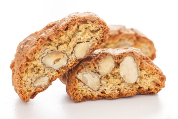 Classic Italian biscotti with nuts on white. - obrazy, fototapety, plakaty