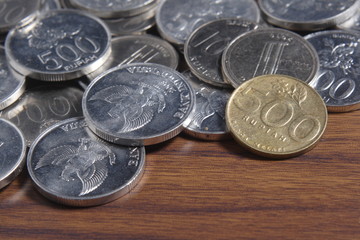 coin rupiah at wooden table