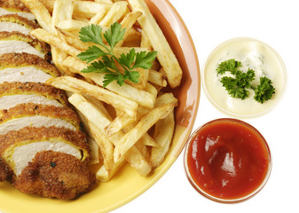 French fries and chicken on the white isolated background