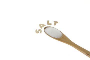 Wooden spoon of salt with the text - Salt