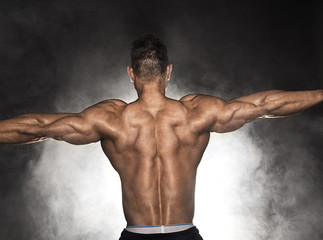 Fototapeta na wymiar Rear view of bodybuilder