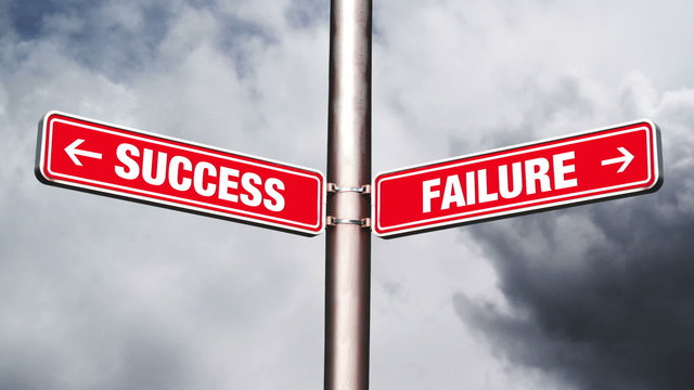 Success of failure road sign pointing to opposite directions.