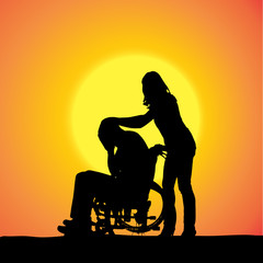 Fototapeta na wymiar Vector silhouettes of people in a wheelchair.