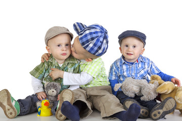 Boy kissing his brother