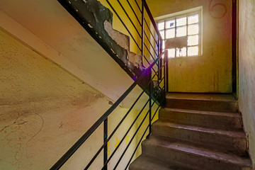 A staircase with a window in an old soviet building in Ukraine