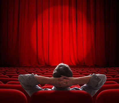 Man Sitting Alone In  Empty Theater Or Cinema Hall