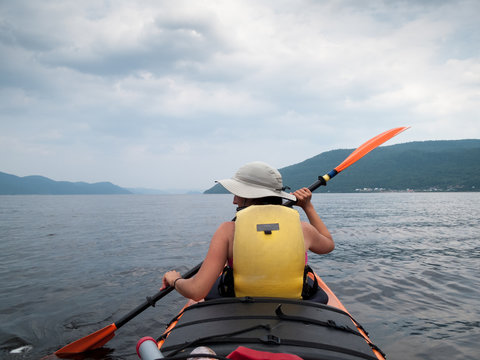 Tourist kayaking in a river, Quebec, Canada