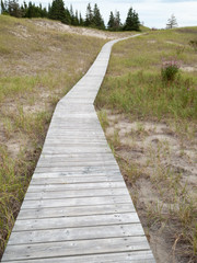 Boardwalk passing through field, Quebec, Canada