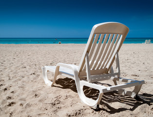 Fototapeta na wymiar Reclining chair on the beach, Havana, Cuba