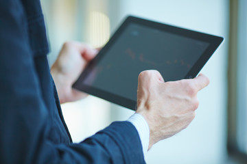 men holding digital tablet