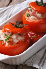 hot appetizer of baked tomatoes filled with rice, vegetables
