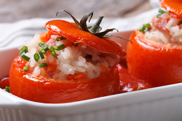 appetizer of baked tomatoes filled with rice, vegetables macro