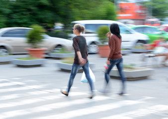 Busy city street women on zebra crossing