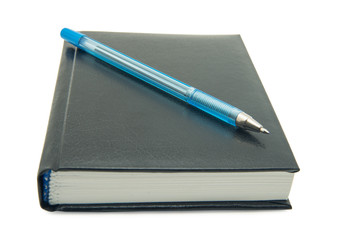 Pen on notebook white background