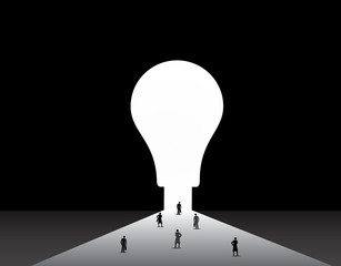 Business men and women standing front of big idea lightbulb door