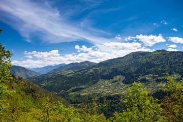 Obraz premium Mountain landscape in Georgia Kaukaz with beautiful sky and tree