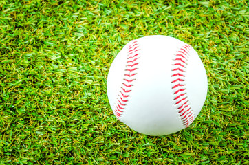 Baseball on green grass