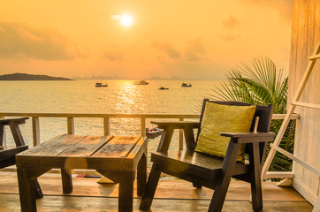 Wood chair sunset on the beach