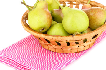 ripe pears in basket isolated on white.