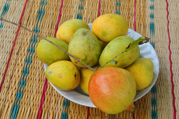 ripe local Thai mangoes and pomegranate