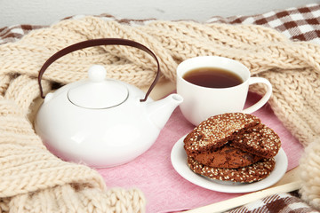 Cup and teapot with cookies