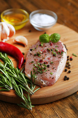 Raw meat steak with herbs and spices