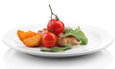 Grilled steak with fried potato pieces and grilled vegetables,